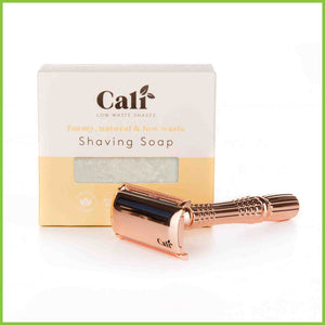 A bar of foaming shaving soap and a copper safety razor.