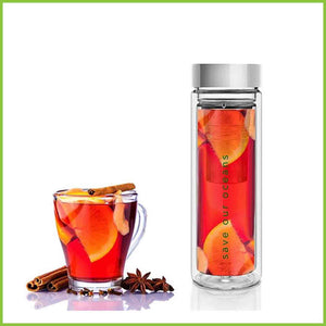 A glass tea flask carrying fruit tea.