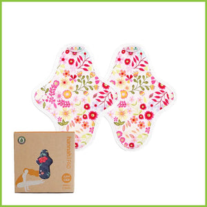 Two reusable sanitary pads in the small size from Hannah. This pack includes two organic cotton pads with a pretty yet bold design on the outer layer known as 'Flower Garden Pink'.