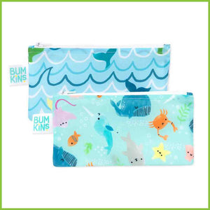 Two Bumkins snack bags - one is blue with waves and whale tails, and the other is an aqua colour with several cute sea creatures such as a whales, crabs, starfish, narwhal, sting rays and seals.