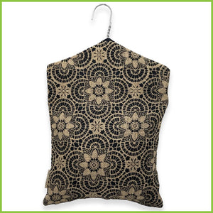 The rear view of the jute peg bag with the geometric floral pattern.