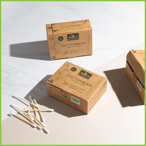 A styled photo of three boxes of Go Bamboo Cotton buds.