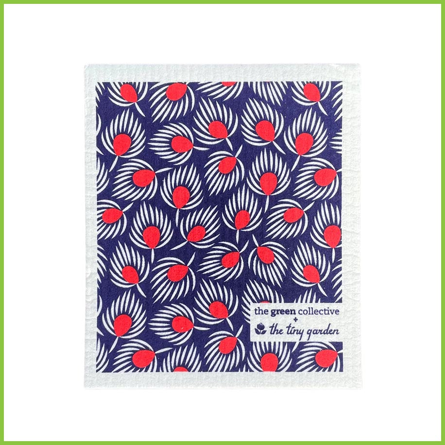 A Spruce Swedish dish cloth with the Fan Feathers design. This dish cloth has a dark blue background, with red and white feathered fans all over it. 