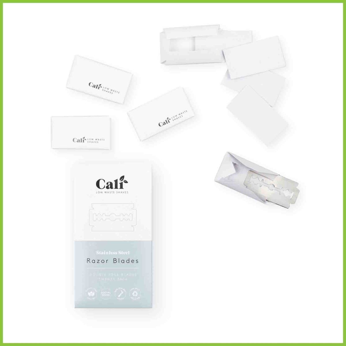 A pack of replacement blades for a safety razor showing some individual blades wrapped in their paper packaging, and some unwrapped.