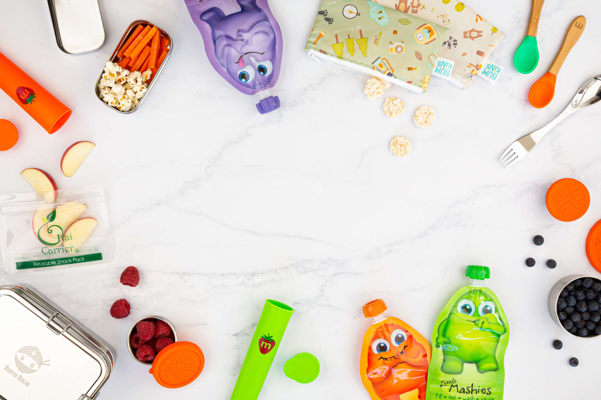 Eco friendly reusables, for kids lunches and snacks. Image include a stainless steel lunchbox, silicone ice pops, reusable food/yogurt pouches, snack pots, snack bags, spoons and a spork.