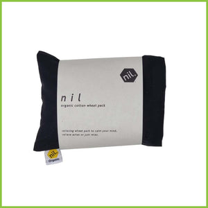 A folded up wheat bag wrapped in a white packaging label. Label reads 'Nil organic cotton wheat pack. Relieving wheat pack to calm your mind, relieve aches or just relax.' This wheat bag is plain black.