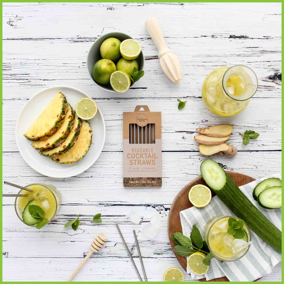 Six stainless steel cocktail straws in packaging on a kitchen table top - drinking straws