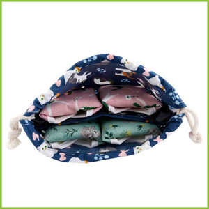 A storage bag for cloth pads with two compartments.