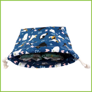A storage bag for reusable cloth bags with a cute cat print.