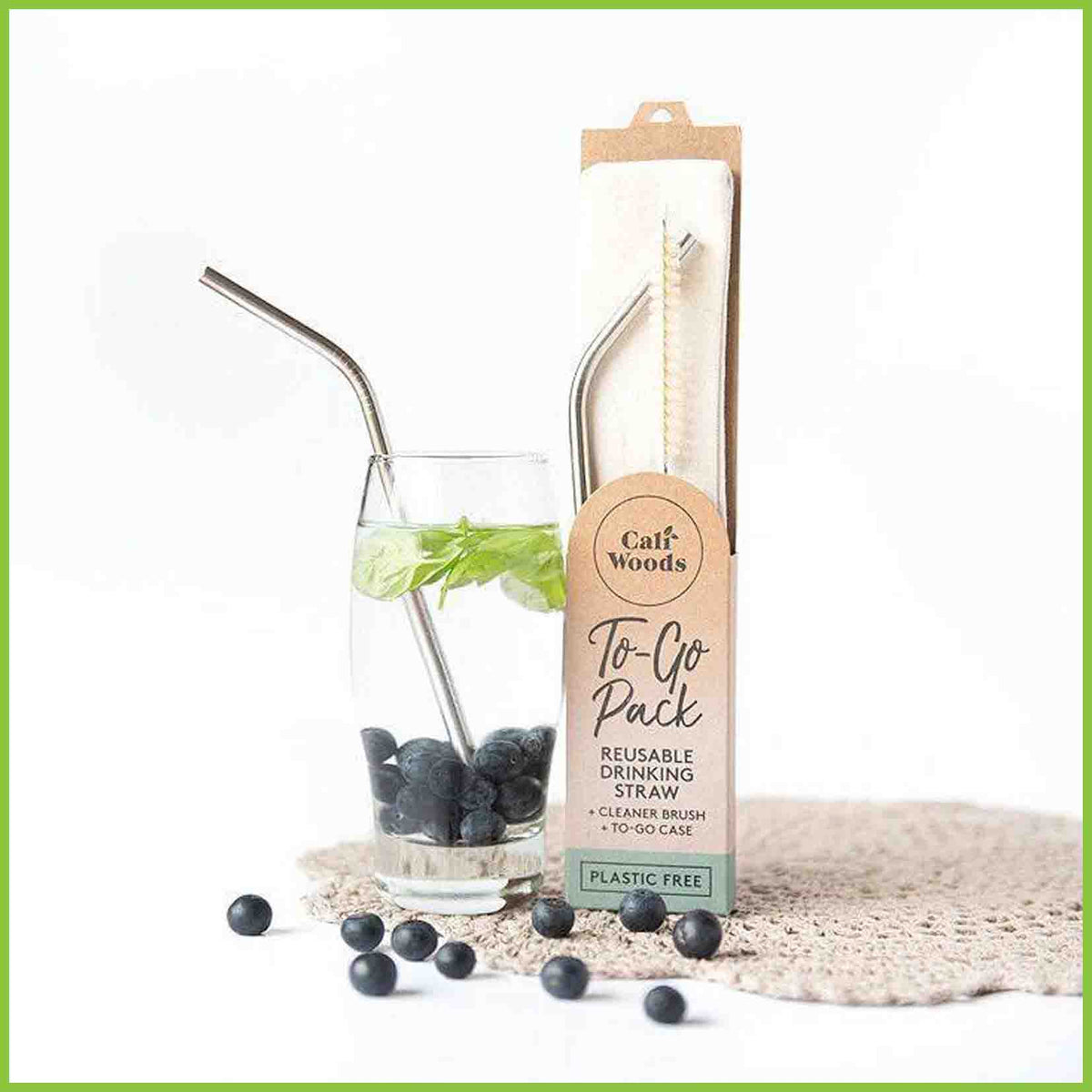 To-go reusable travel pack including a stainless steel drinking straw, a cleaner brush and a cotton carry pouch. Demonstrated with a berry flavoured water drink.