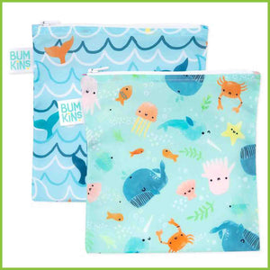 Two Bumkins large snack/sandwich bags. One with a blue ocean waves with whale tails, and the other with a variety of cute ocean animals including whale, jellyfish, crab, fish and starfish.