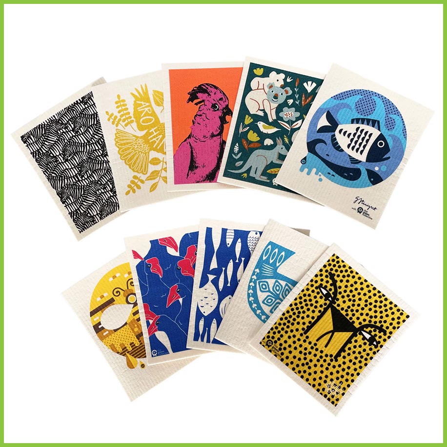 A selection of different Spruce dish cloths fanned out on a white surface.