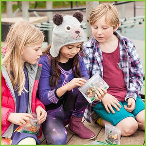 Kids eating snacks using Kai Carrier's snack bags