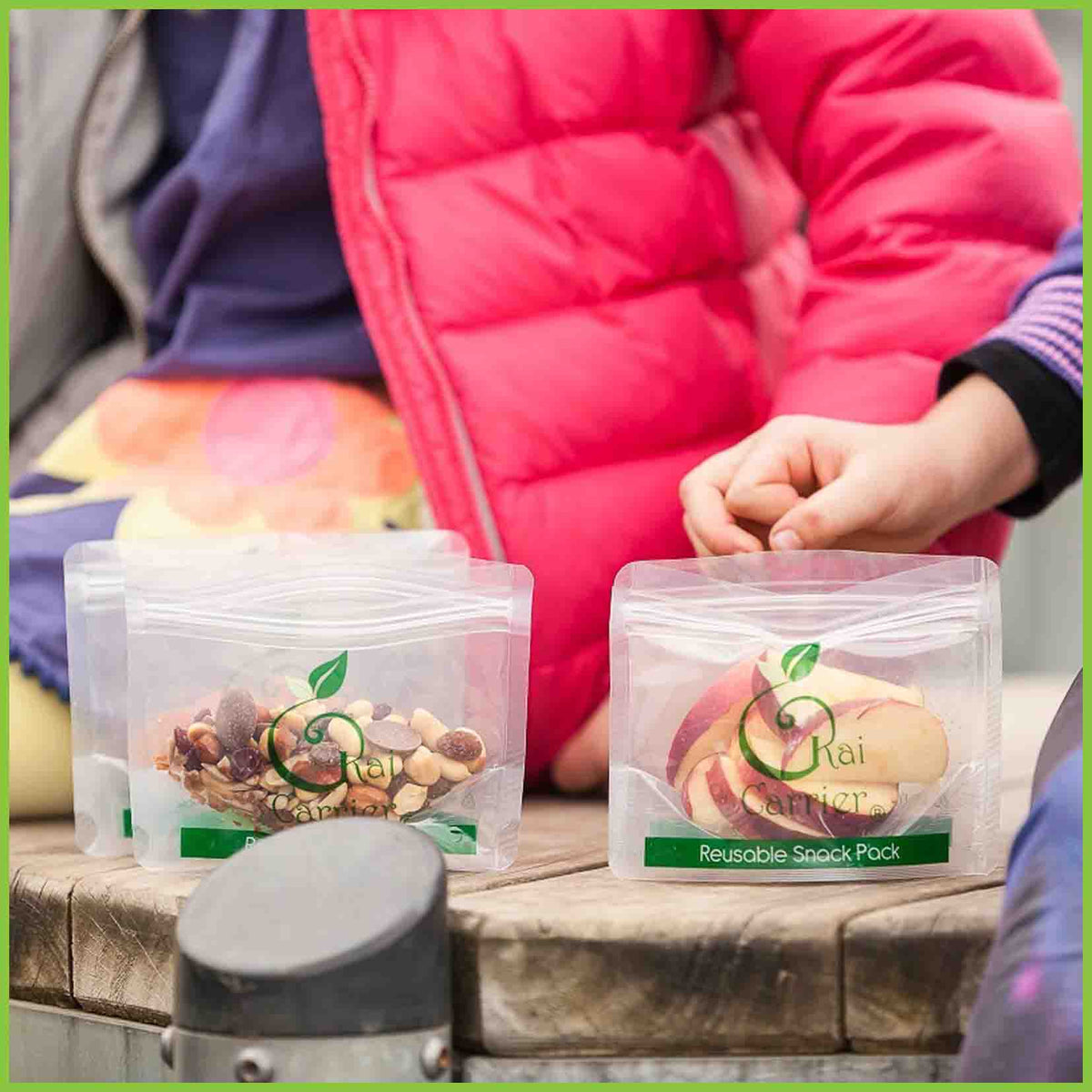 Kai Carrier reusable snack bags being demonstrated holding school snacks.