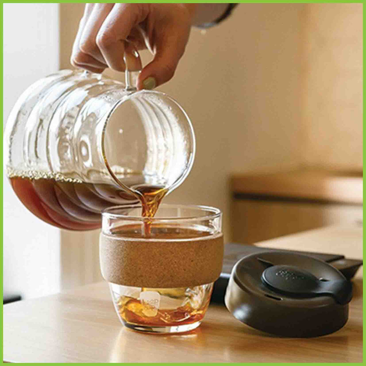 A KeepCup Cork reusable cup having coffee poured into it.