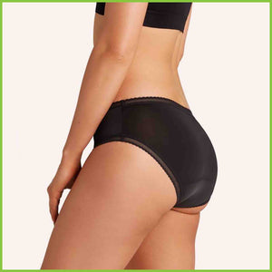 Love Luna Period Underwear in the bikini brief style shown on a model from a side view
