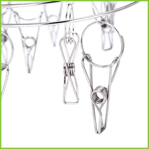 Close up of pegs on the stainless steel laundry hanger
