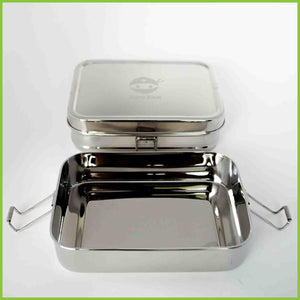 A stainless steel lunchbox by Bento Ninja with the bottom layer open.