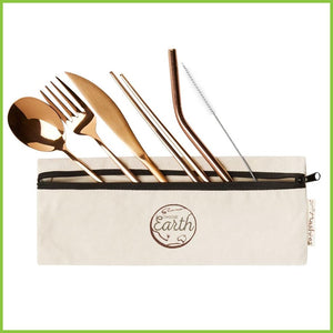 A rose-gold spoon, fork, knife, set of chopsticks, straw and a straw cleaner, laying half in and half out of a travel cotton case with a zip.